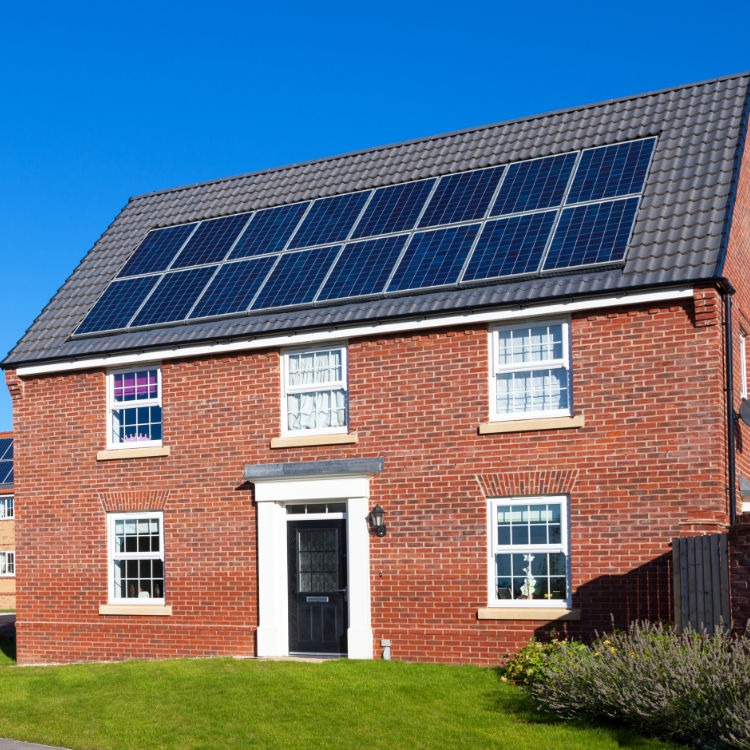 Solar panels on roof of detached house