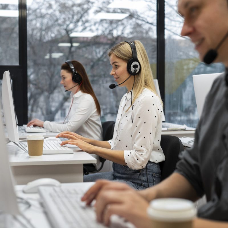 Office team at desks answering phone calls